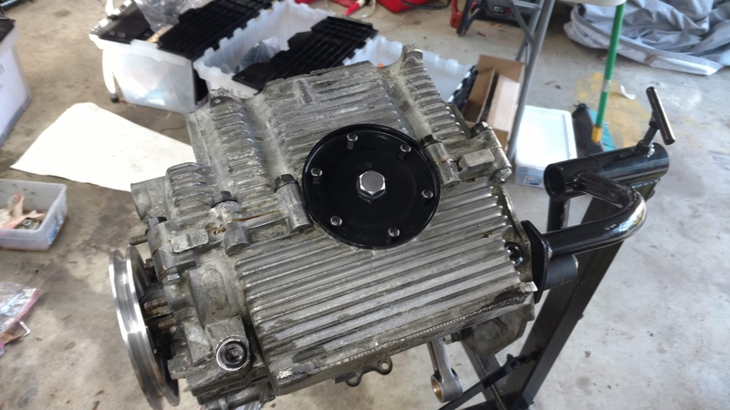 Installing the oil screen and sump plate.