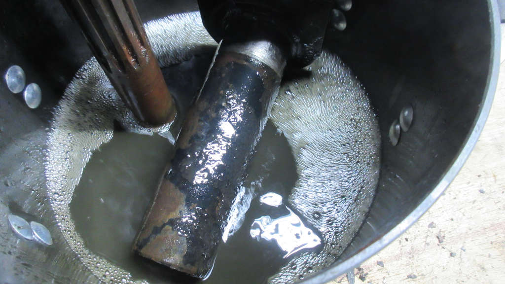 Spring plate soaking in mineral spirits