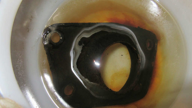 Spring plate covers soaking in mineral spirits